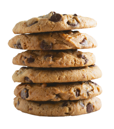 Stack of six golden-brown chocolate chip cookies with visible chocolate chunks, arranged vertically against white background.