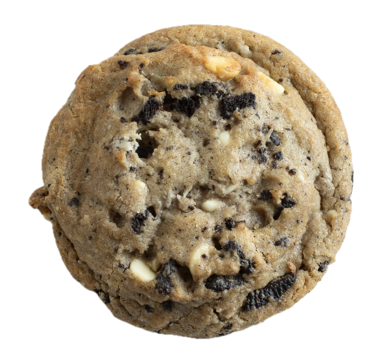 A golden-brown cookies and cream cookie with dark cookie chunks and white cream pieces scattered throughout on a white background.
