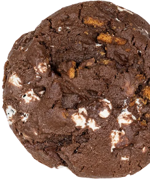 Double chocolate brownie cookie with white chocolate chips and caramel pieces on white background