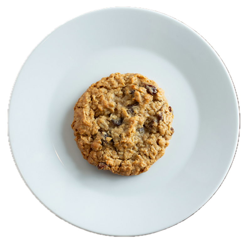 Oatmeal raisin cookie with visible oats and dark raisins on a light blue ceramic plate against white background