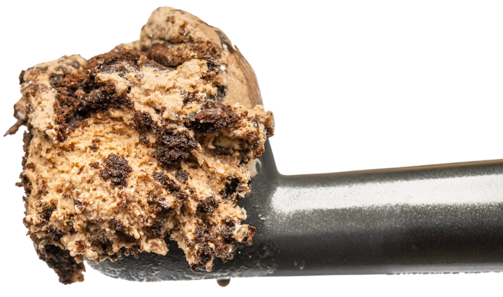 A scoop of chocolate chip cookie dough ice cream on a black ice cream scoop against white background.